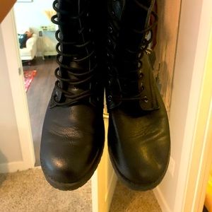 Black combat boots. Slightly worn.
